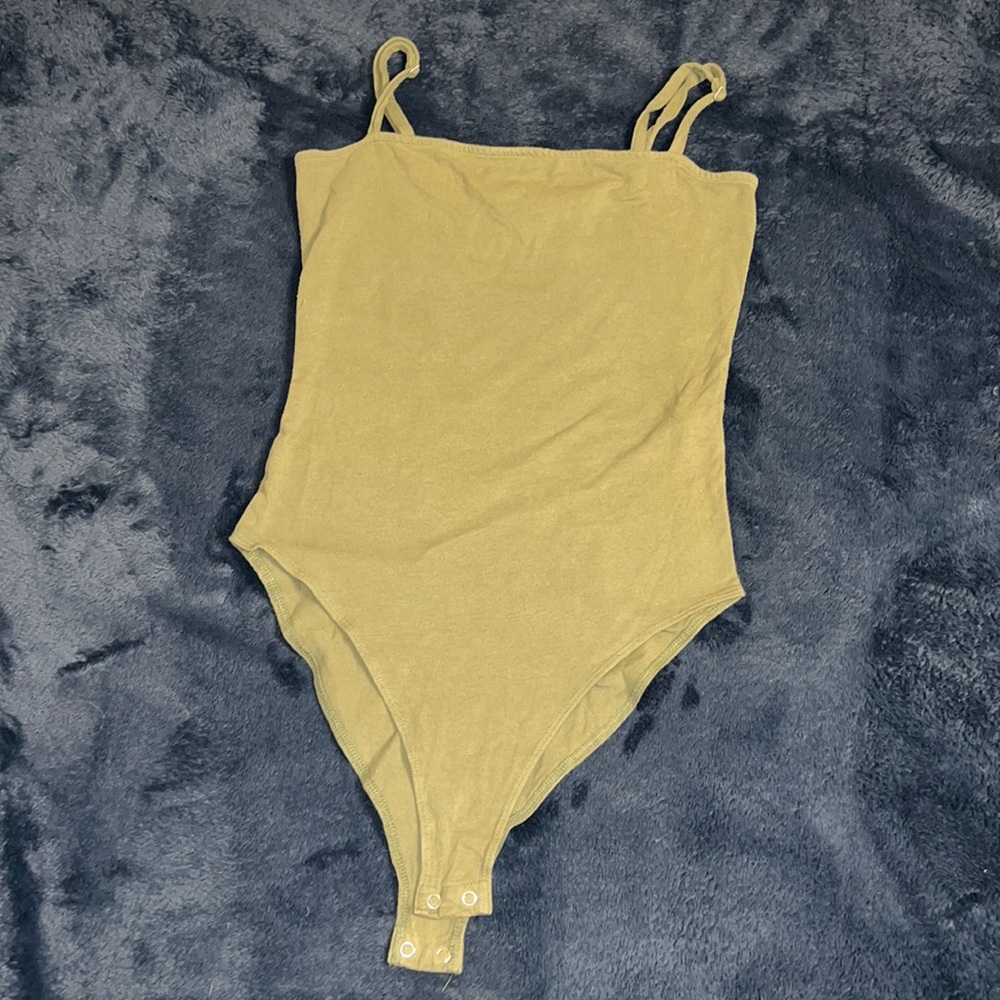 Green bodysuit.